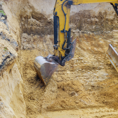 Excavator performing land excavation in Charlotte, NC.