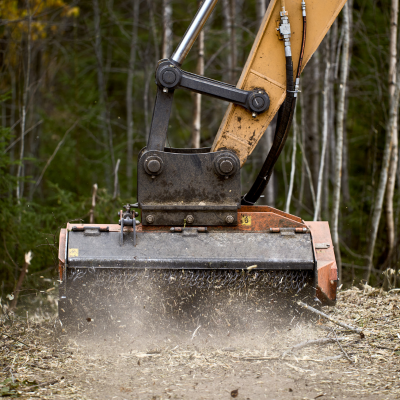Forestry mulcher working through dense vegetation in Charlotte, NC.